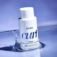 Color Wow Curl Wow Hooked 100% Clean Shampoo flacon in water